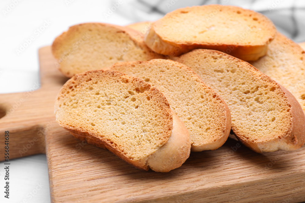 Tasty hard chuck crackers on white wooden table, closeup Tasty hard chuck crackers on white wooden table, closeup
