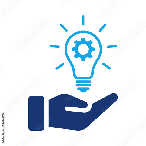 Hand holding light bulb with cogwheel