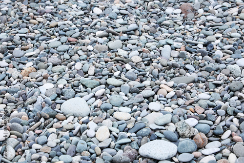 Surface covered with many different pebbles as background