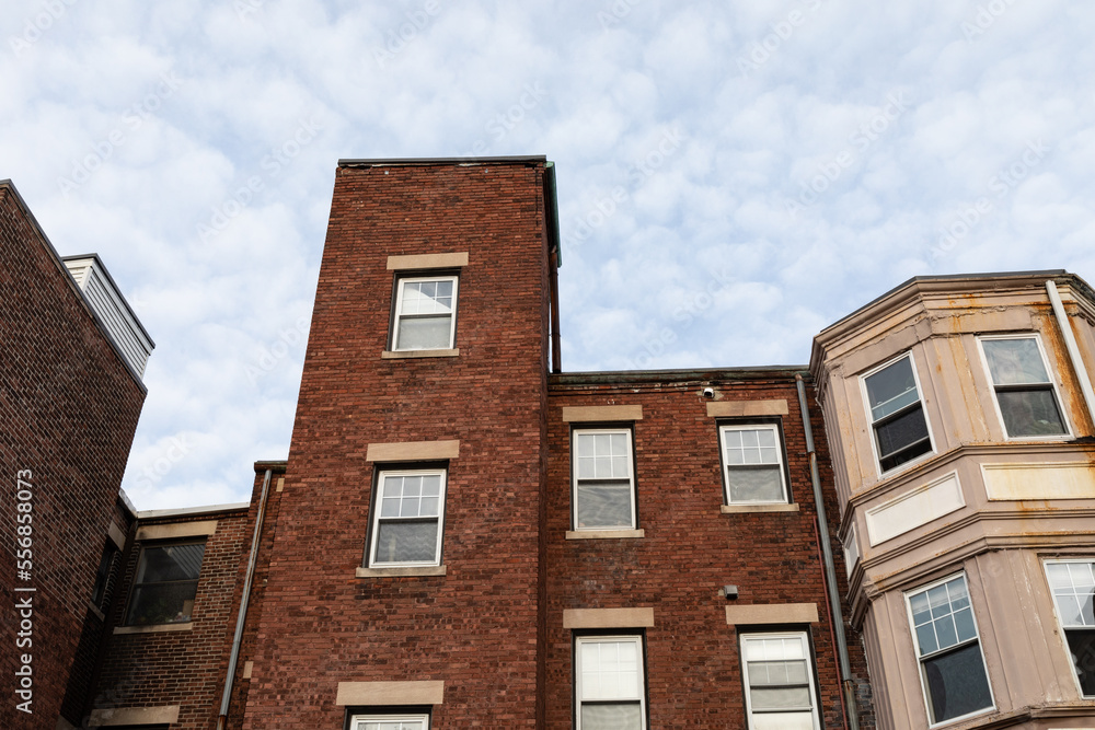 Rear view of three different styles of old brick apartment buildings, urban landscape looking up, horizontal aspect Rear view of three different styles of old brick apartment buildings, urban landscape looking up, horizontal aspect
