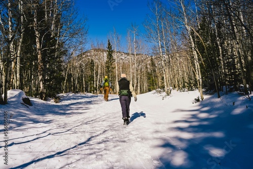 Two People hiking in the Rocky Mountains in winter - outside of Boulder, Colorado © Rachel