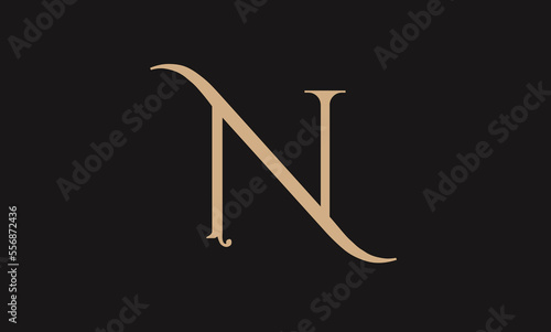 Alphabet N illustration monogram vector logo design in silver color and black background. photo