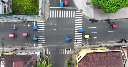 Aerial Drone fly view of moto taxi tuk tuk tuks and heavy traffic close to Belen market in Iquitos, Peru, South America. 4k High resolution video photo