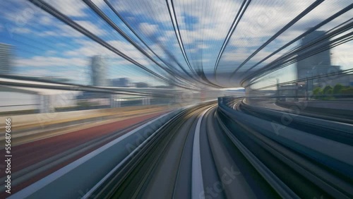 going by fast train, hyper lapse of futuristic automated train in Tokyo, Japan. Advanced engineering, transportation system, Asia tourism, transport technology concept