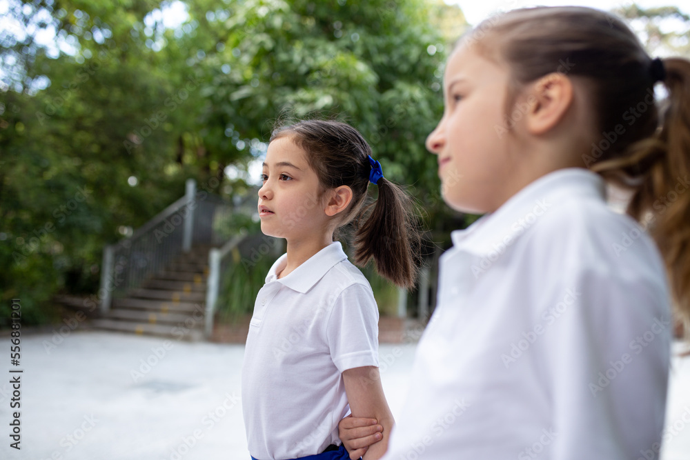 Two Schoolgirls Together in Playground Two Schoolgirls Together in Playground