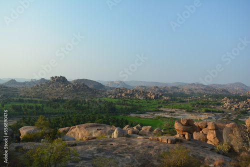 Landscape view of Hampi, a riot of colors, and rocky landscape.Ruins of Vijayanagara Empire. A UNESCO World hertiage site. Image of Rocky landscape.