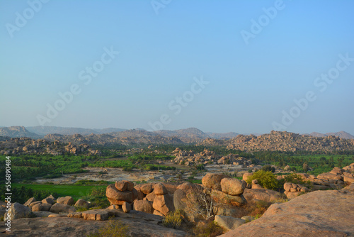 Landscape view of Hampi, a riot of colors, and rocky landscape.Ruins of Vijayanagara Empire. A UNESCO World hertiage site. Image of Rocky landscape. photo