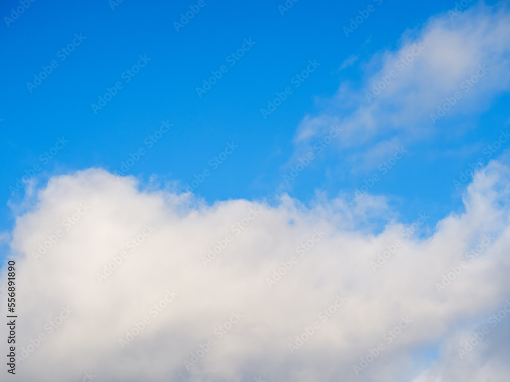 White fluffy soft clouds against a blue sky White fluffy soft clouds against a blue sky