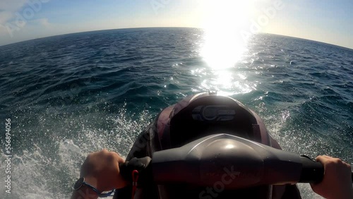 POV riding a Jetski towards the ocean in the caribbean photo