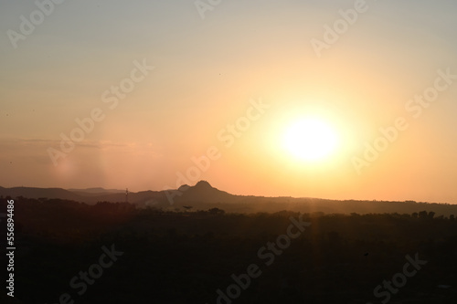 Silhouette image of a hill. Image of a Sunset behind the hill © Srijita Photography