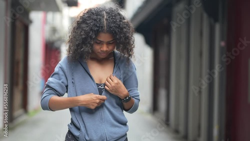 african woman take of jecket and ready to work out. woman wears sport suite for fitness and work out. Sexy girl in shape. Fitness and sport motivation. Runner concept. photo