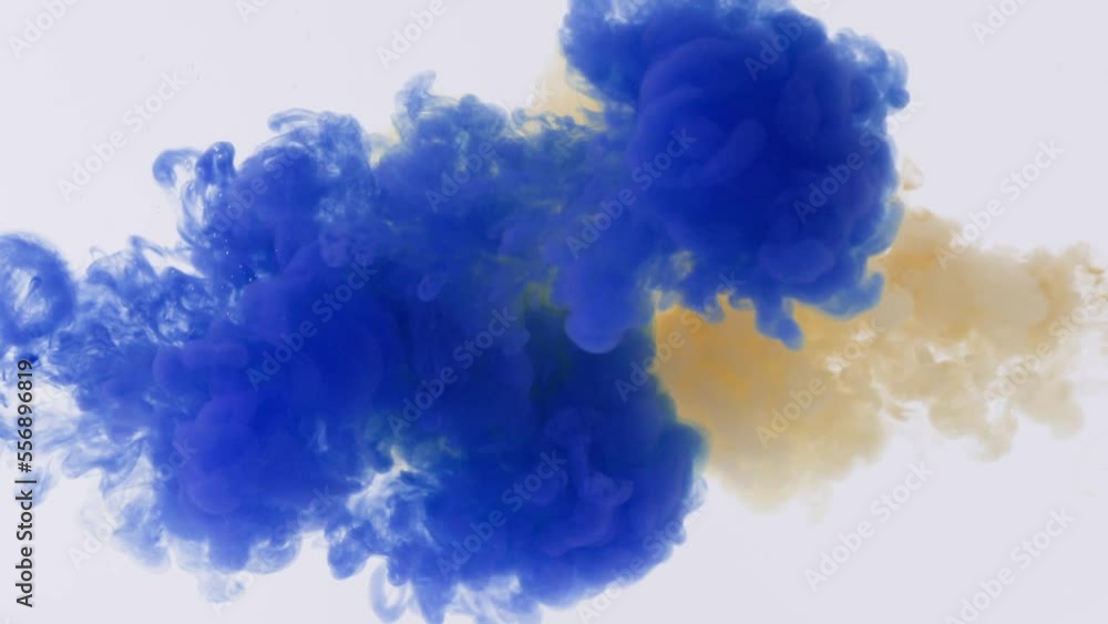 Blue and orange paints jets spread over water and create interesting patterns. Blue and orange liquid ink leaves lines in clean water super slow motion Blue and orange paints jets spread over water and create interesting patterns. Blue and orange liquid ink leaves lines in clean water super slow motion