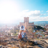 woman tourist enjoying Atalaya castle in Spain