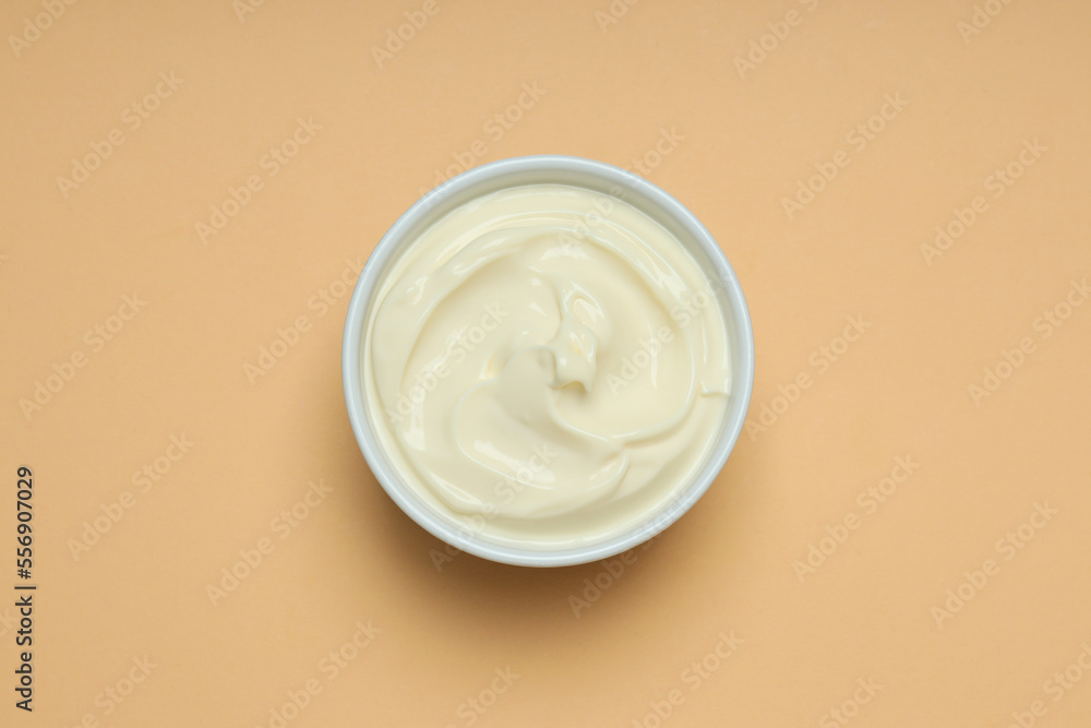 Concept of egg sauce, mayonnaise on beige background Concept of egg sauce, mayonnaise on beige background
