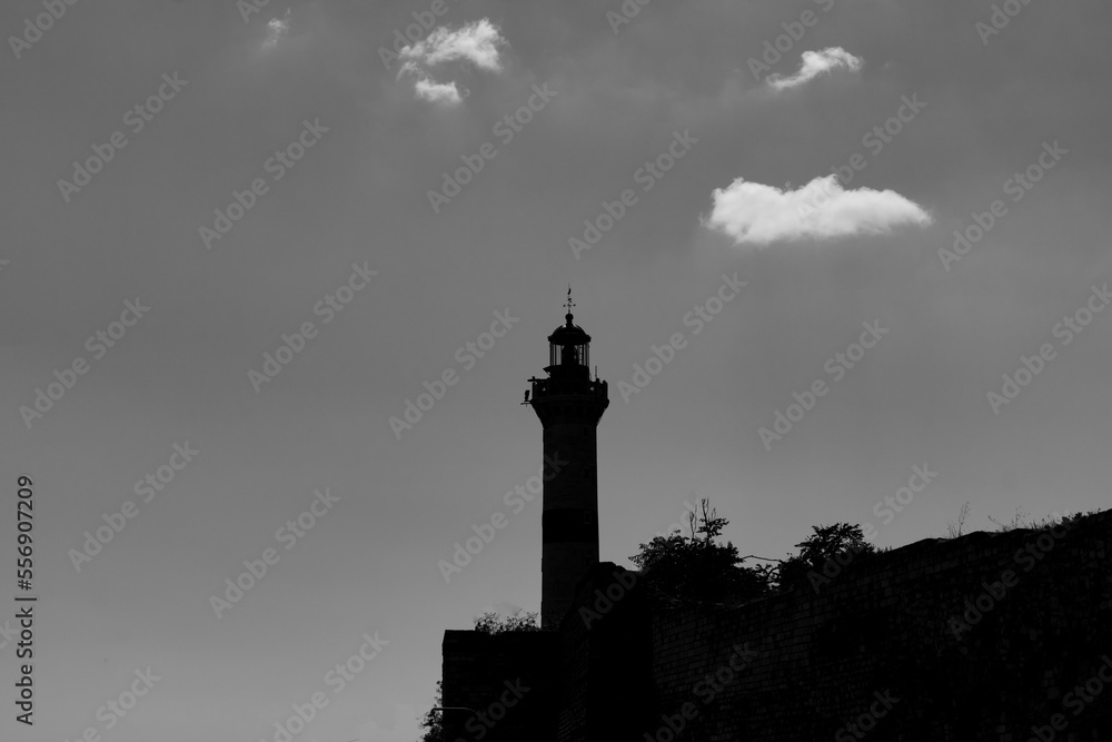 Silhouette of a lighthouse. Monochrome view of a lighthouse
