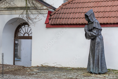 Black metal statue of a faceless monk in Tallinn.