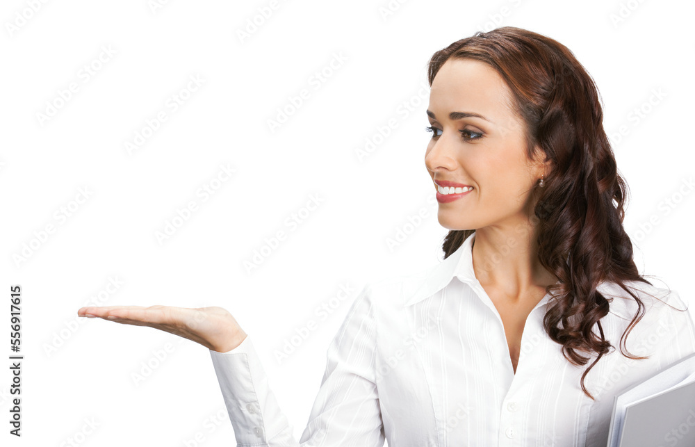 Portrait image of smiling business woman with grey folder showing, pointing, advertising, isolated white background. Profile side businesswoman, office worker, teacher or real estate agent. Portrait image of smiling business woman with grey folder showing, pointing, advertising, isolated white background. Profile side businesswoman, office worker, teacher or real estate agent.