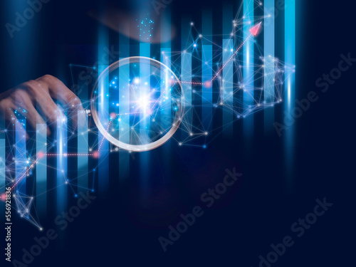 Businessman holding a graph goal of business Investor,analysis economic and calculates financial data and target for long-term investments and profitability in future on digital data system manager.