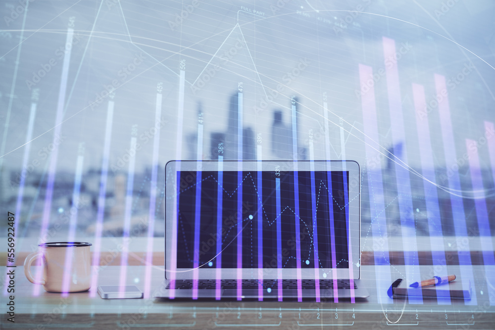 Stock market graph and table with computer background. Double exposure. Concept of financial analysis. Stock market graph and table with computer background. Double exposure. Concept of financial analysis.