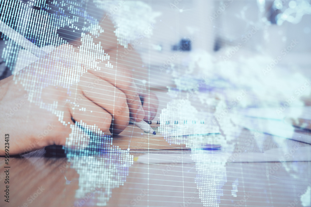 Double exposure of hands and notepad with business icons. Double exposure of hands and notepad with business icons.