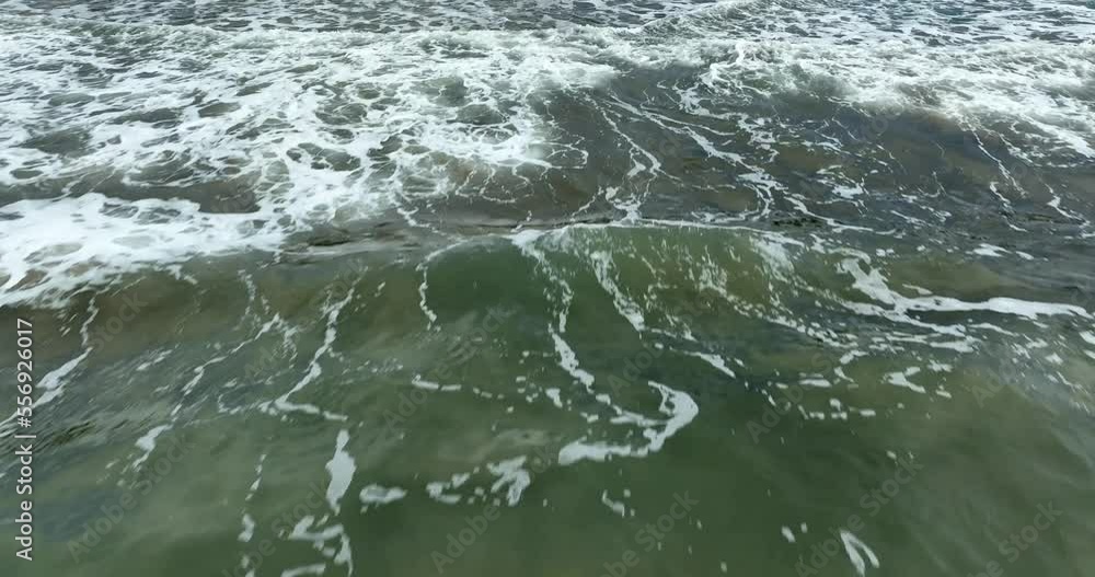 View from above, flying over the sea with waves breaking on a beautiful beach. Surf, wave surf. View from above, flying over the sea with waves breaking on a beautiful beach. Surf, wave surf.