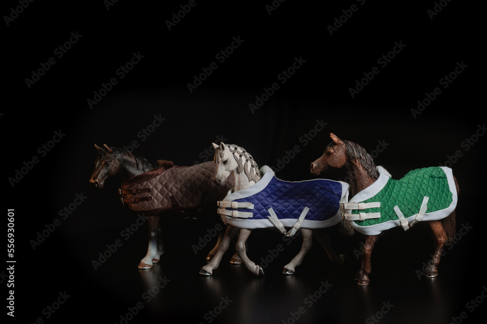 Fototapeta premium Black toy horse isolated on black background