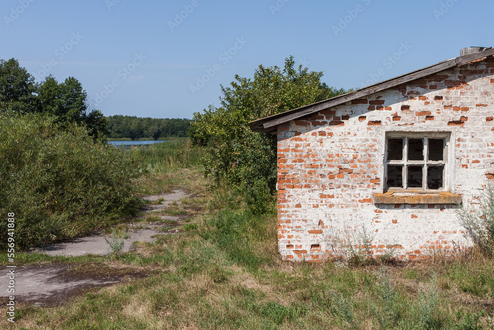 The window of a ruined house. Ruins of an old farm The window of a ruined house. Ruins of an old farm