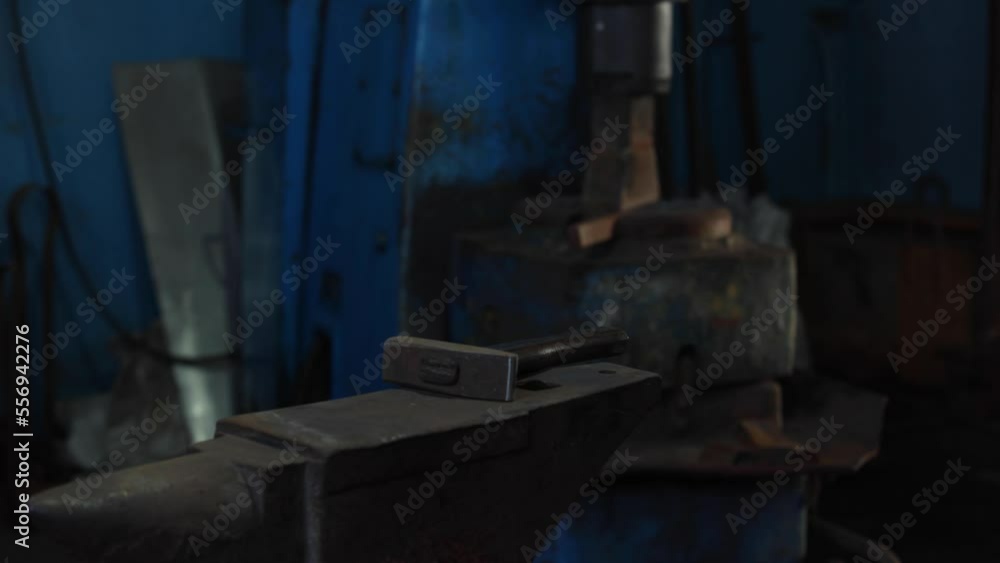 A blacksmith forges a red hot metal billet with a blacksmiths hammer. Production. Handmade work. 60 fps 4K UHD A blacksmith forges a red hot metal billet with a blacksmiths hammer. Production. Handmade work. 60 fps 4K UHD