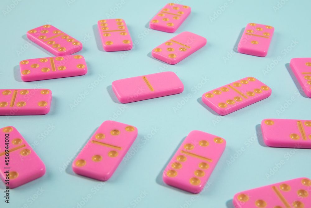 Pink domino on cyan background Pink domino on cyan background