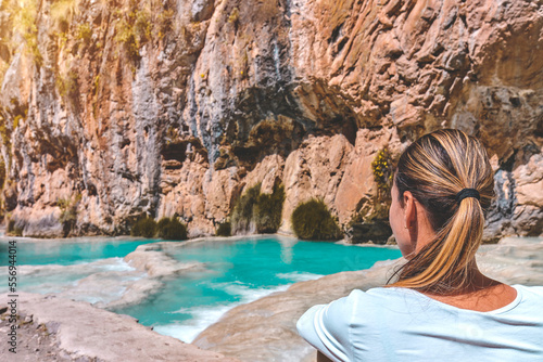 Young woman at viewpoint of the natural pools of Millpu, Ayacucho, Peru. Concept about travel photo