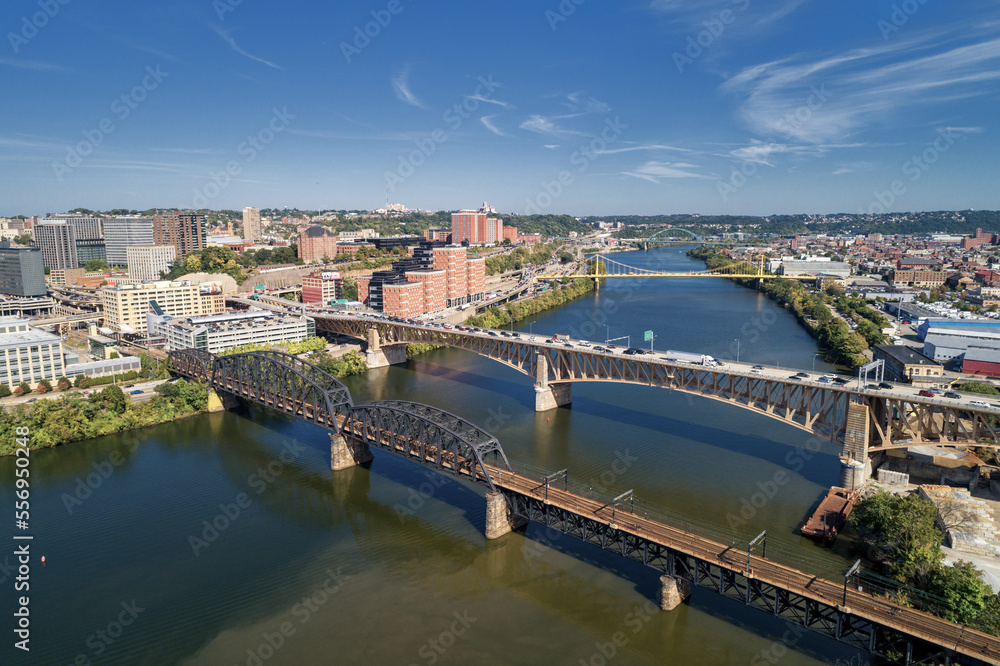Pittsburgh Skyline with Downtown and Business District. Train Bridge and Liberty Bridge Pittsburgh Skyline with Downtown and Business District. Train Bridge and Liberty Bridge