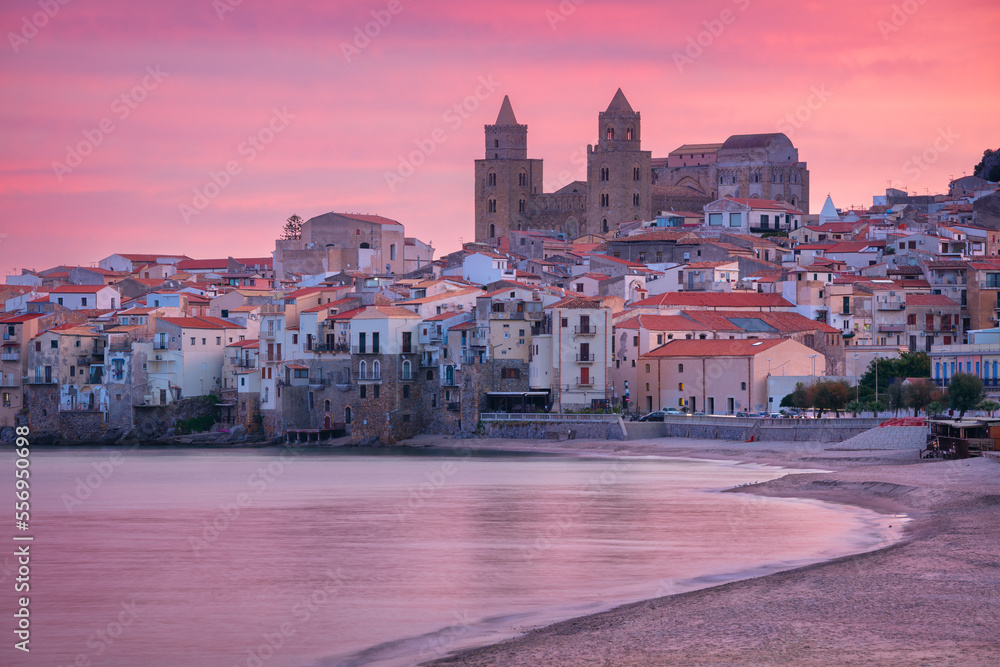 Cefalu, Sicily, Italy. Cityscape image if coastal town Cefalu in Sicily at dramatic sunrise.