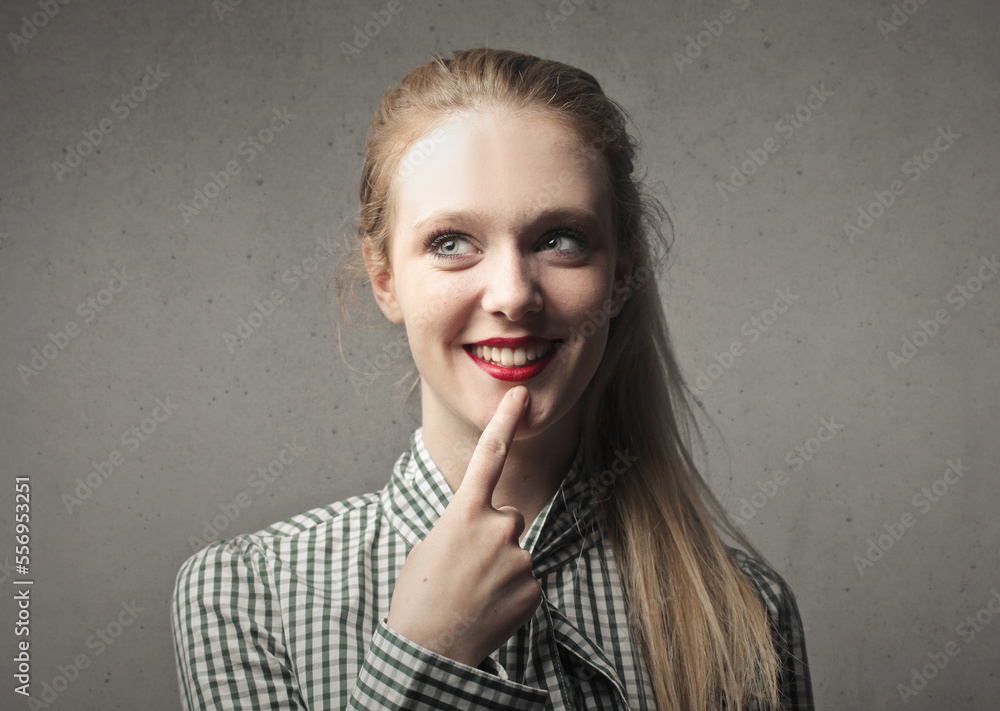 portrait of young woman with thinking expression portrait of young woman with thinking expression
