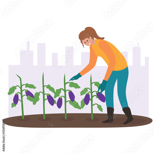 Gardener working in the garden with city buildings behind. Urban Garden scene.