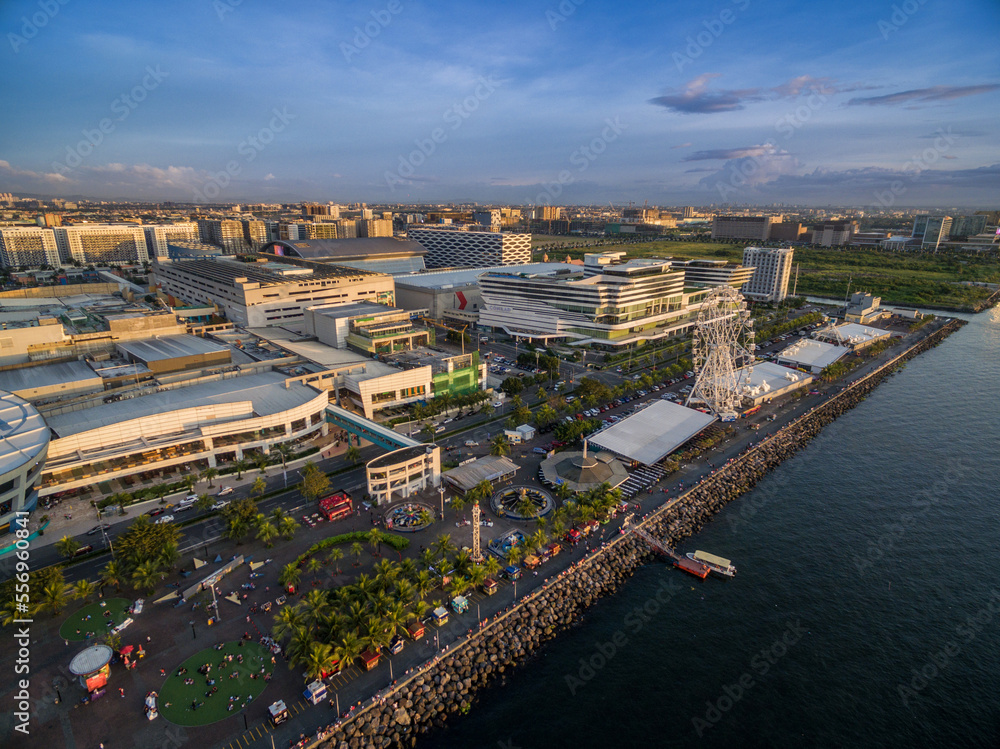 Mall of Asia in Bay City, Pasay, Manila Philippines with Pier and Cityscape.