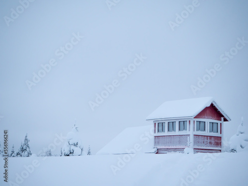 Lonely red house in the snow