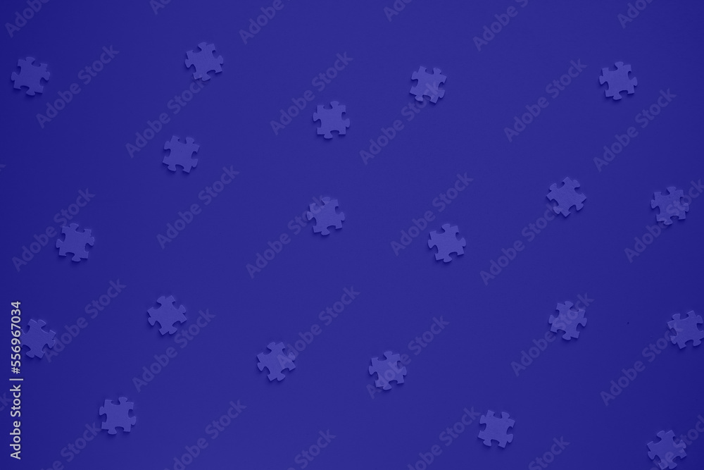 Flat blank wooden puzzles on a blue background view from above. Festive background for a congratulatory inscription. New Year, Christmas, Holy Valentine. Festive decor. Blurred background Flat blank wooden puzzles on a blue background view from above. Festive background for a congratulatory inscription. New Year, Christmas, Holy Valentine. Festive decor. Blurred background