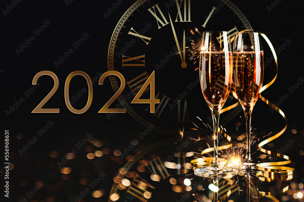 Happy New Year 2024! Two glasses with champagne, ash and serpentine