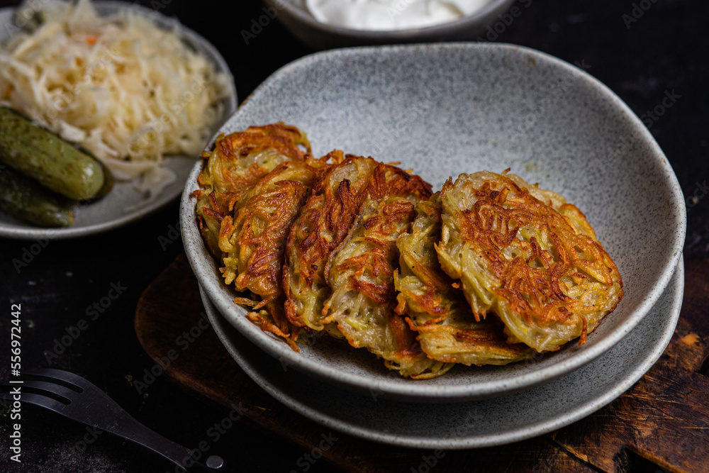 Potato pancakes in a bowl. Draniki.