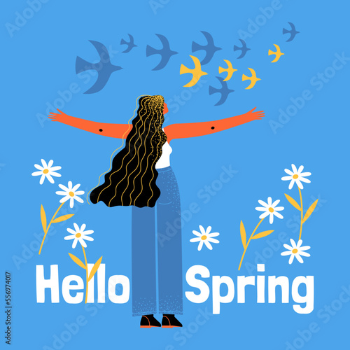 The girl looks at the arriving birds on a blue background with large daisies. Symbolic image of the arrival of spring
