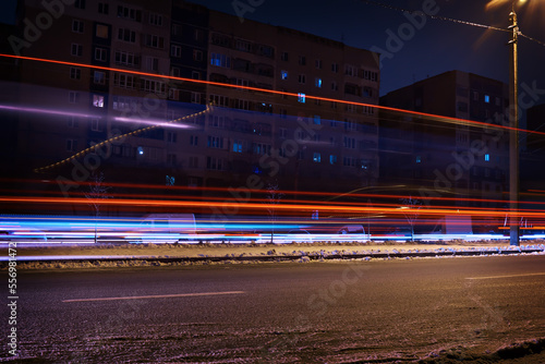 Ukraine - winter, the city during a blackout, after Russian missile strikes on the country's energy sector. Light glare from cars and public transport.