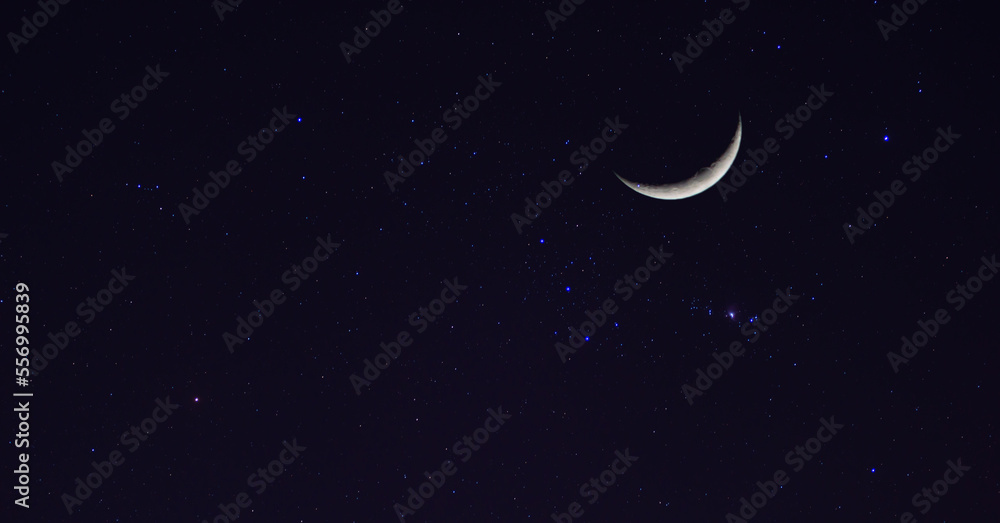 Amazing crescent moon on dark blue night sky background, starry universe, nebula and galaxies with noise and grainy, selective focus. Amazing crescent moon on dark blue night sky background, starry universe, nebula and galaxies with noise and grainy, selective focus.