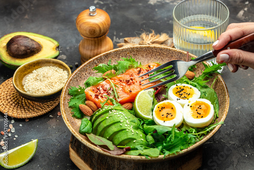 salmon salad with greens, eggs and avocado. Delicious breakfast or snack, Healthy keto lunch or dinner. top view copy space