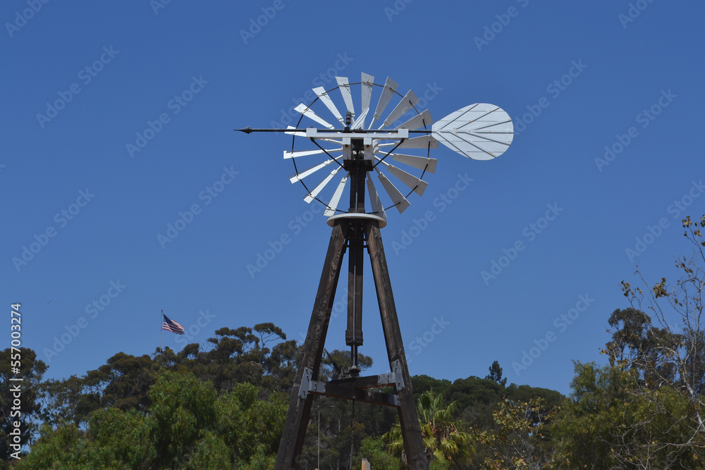 Traditional windmill in a farm with blue sky background Traditional windmill in a farm with blue sky background