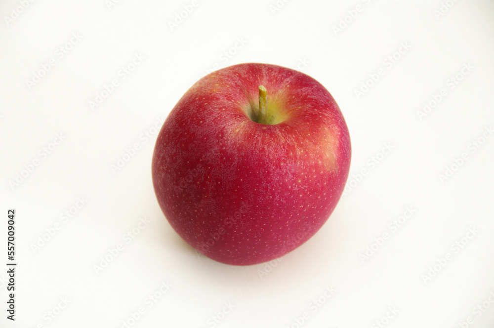 Red apple on a white background. Close-up with copy space.