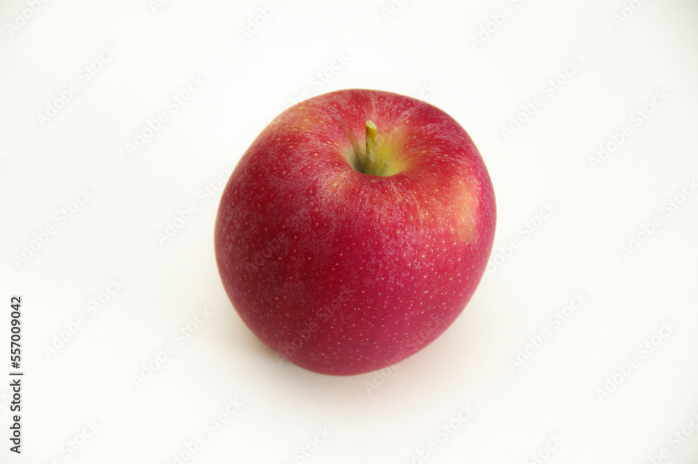 Red apple on a white background. Close-up with copy space. Red apple on a white background. Close-up with copy space.