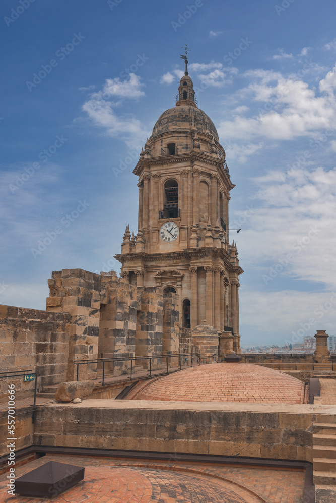 Panorama of Malaga city center and seaport  from the roof of La Manquita Cathedral. La Manquita Cathedral roof tour. Amazing view, blue sky above. Andalusia, Spain