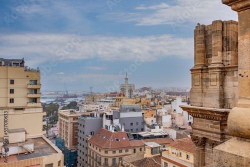 Panorama of Malaga city center and seaport  from the roof of La Manquita Cathedral. La Manquita Cathedral roof tour. Amazing view, blue sky above. Andalusia, Spain photo