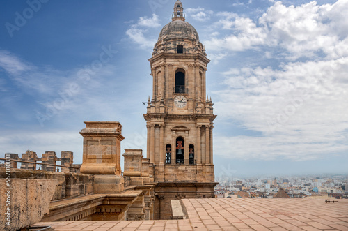 Panorama of Malaga city center and seaport  from the roof of La Manquita Cathedral. La Manquita Cathedral roof tour. Amazing view, blue sky above. Andalusia, Spain