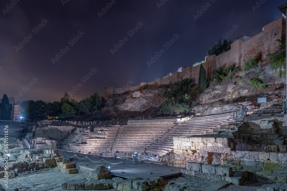Panorama view from  C/ Alcazabilla street at Old Roman theater in Malaga and The Alcazaba, citadel of Malaga City at night, amazing night photography, Andalusia, Spain